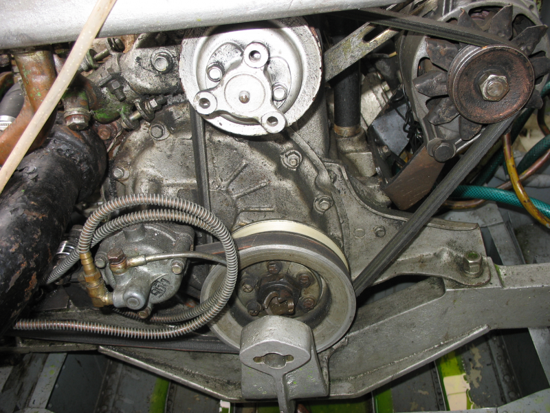 Engine - alternator (right), vacuum pump for carburator RPM limiter (left)
